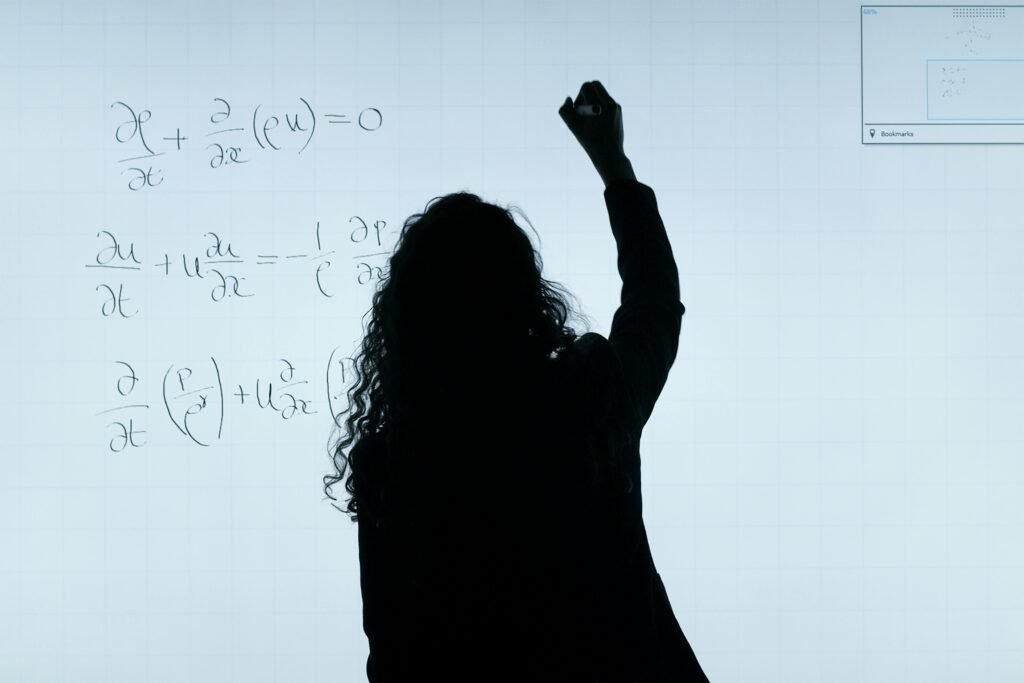 Thumbnail Image of a person writing partial derivatives on a whiteboard